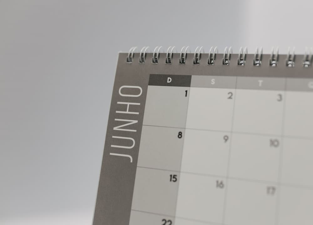 A spiral-bound month calendar, open